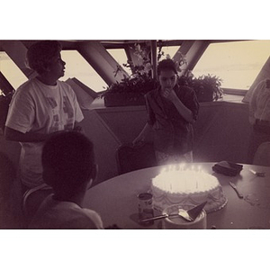 Villa Victoria residents celebrate someone's birthday on board a Boston Harbor Cruises boat.