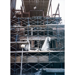View from below of the scaffolding and framing of Taino Tower which is under construction.