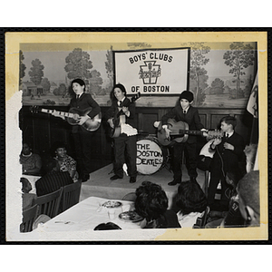 Boys perform as The Boston Beatles during a Mothers' Club banquet