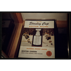 A photograph of a Boston Bruins' program from the 1972 Stanley Cup in the New England Sports Museum. The cover reads, "1972 Series - Stanley Cup - Boston Bruins - National Hockey League - Boston Garden - Official Hockey Program and Sports Magazine - $1 - 97 CENTS - plus 3 cents sales tax"