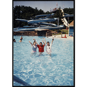 Three girls stand in a pool at Water Country water park during a Tri-Club field trip