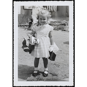 Miss South Boston, the Little Sister Contest winner, holding her prizes