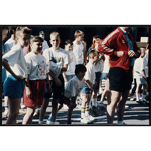 Children wait at a start line during the Battle of Bunker Hill Road Race