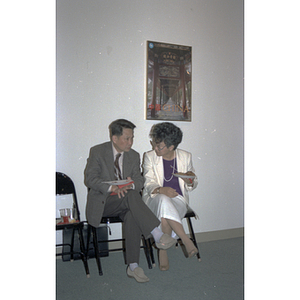 Suzanne Lee sits and chats with a member of the Consulate General of the People's Republic of China at a welcome party for the visitors