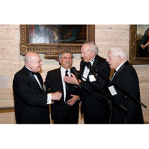 Four men in tuxedos at the Museum of Fine Arts for President Aoun's inauguration celebration