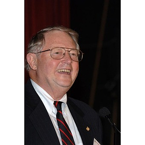 Neal Finnegan, Chairman of the Board of Trustees, speaks at the Alumni ...