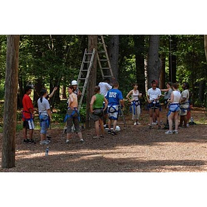 Torch Scholars stand in their harnesses at the Project Adventure Ropes ...