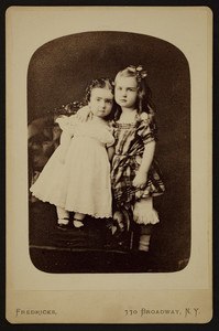 Double full-length portrait of Alice and Clarence Bowen, standing, facing front, Fredricks' Knickerbocker Family Portrait Gallery, 770 Broadway, corner 9th Street, New York, New York, undated