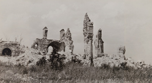 View of destroyed stone vaults and columns, standing in a field