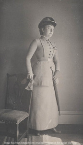 Mrs. Willius [?] Peters, standing, hand on chair