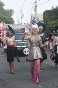 Parade marcher dressed as a majorette : Provincetown Carnival parade