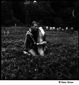 Camp Arcadia: camper hugging a gravestone