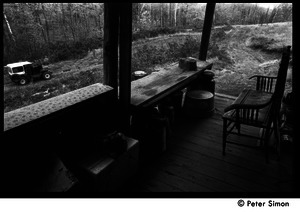 Back porch of Packer Corners commune: view of the woods from the porch
