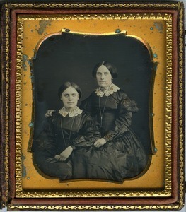 Emily (r.) and Hannah Cornelia Scott: double three-quarter length studio portrait with arm around