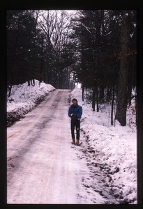 Boy on snowy road, Wendell Farm