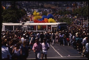 City buses and crowd at the San Francisco Pride Parade
