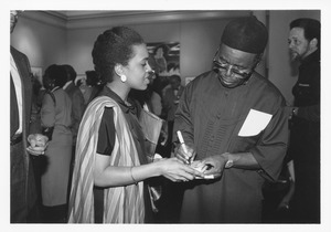 Chinua Achebe and Malaika Adero at a reception