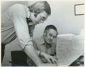 Roy Rule and Joe Park reading a map