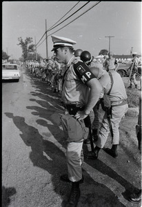 Antiwar demonstration at Fort Dix, N.J.: line of military policeman along road