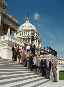 Congressman John W. Olver and group of visitors, posed on the steps of the United States Capitol building