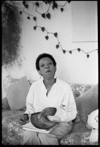 Cuban writer Nancy Morejón, seated on a couch