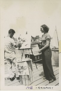 Bernice Kahn talking to a painter on a dock