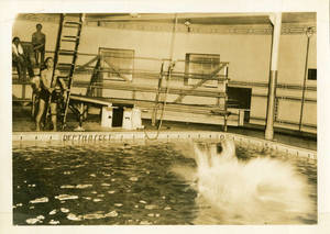 Student's splash after jumping into McCurdy Natatorium
