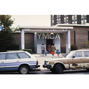 Parents and children walking into the Dorchester YMCA