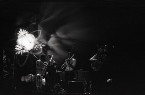 Taj Mahal in concert at Northfield, Mass.: horn section playing in front light show