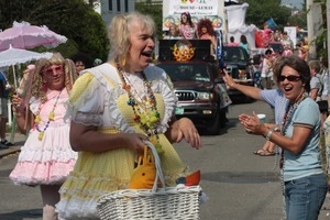 Parade marcher in yellow gingham with a basket : Provincetown Carnival parade