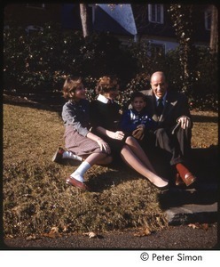 Carly, Lucy, Peter, and Richard Simon outside their family home