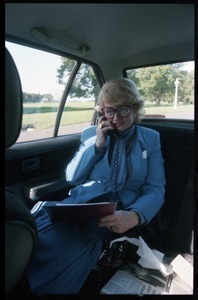 Margaret Heckler, United States Ambassador to Ireland, taking a phone call in the back of a limousine