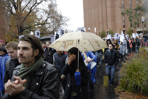 UMass student strike: strikers marching past the Du Bois Library