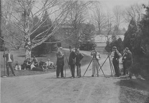 Class of 1911 surveying the landscape with tripods