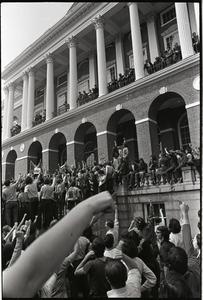 Demonstration at State House against the killings at Kent State: protesters shaking their fists at the State House