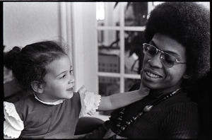 Herbie Hancock with daughter Jessica in lap - Digital Commonwealth