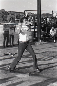 Boston Phoenix vs. WBCN staff softball game: man swings while others look on