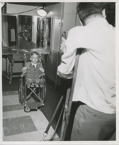 Boy in wheelchair has picture taken