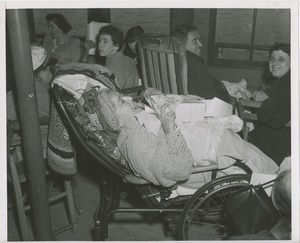 Woman in reclining wheelchair