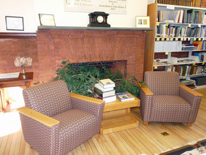 Buckland Public Library: interior view of casual seating by the fireplace