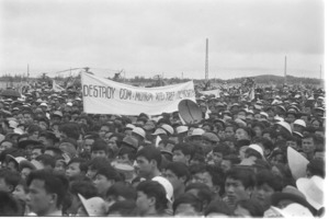 Banner which reads "Destroy Communism and Free the North;" Saigon.