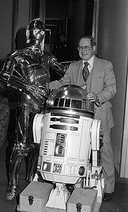 Unidentified man with R2-D2 and C-3P0 from Star Wars films at Boston City Hall