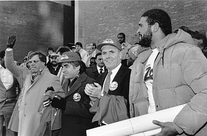 Mayor Raymond L. Flynn outside City Hall with Governor Michael S. Dukakis, City Councilor Thomas M. Menino and New Englad Patriots player Brian Holloway at celebration for New England Patriots 1985 team