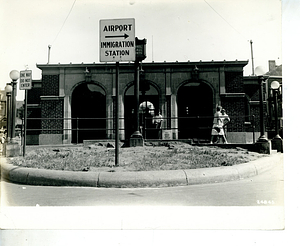 Sign for the airport and the East Boston Immigration Station