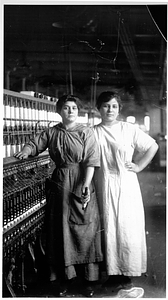 Two female textile workers at a spinning frame. [08]