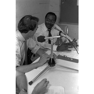 Joseph Warren, right, speaking on a radio segment on WRBB, Northeastern's radio station