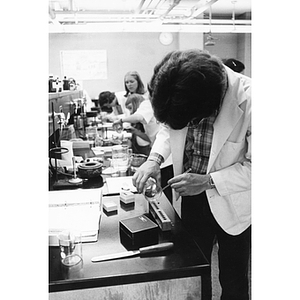 A pharmacy student works in a laboratory