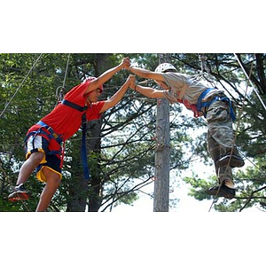 Danny Vazquez and Odalis David Polanco work together on the Torch Scholars Project Adventure Ropes Course