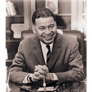 Portrait of Edward Brooke seated at his desk