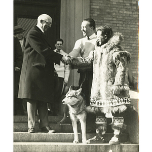 Northeastern University President Frank Palmer Speare shaking hands with Leonhard Seppala, King Husky I's breeder